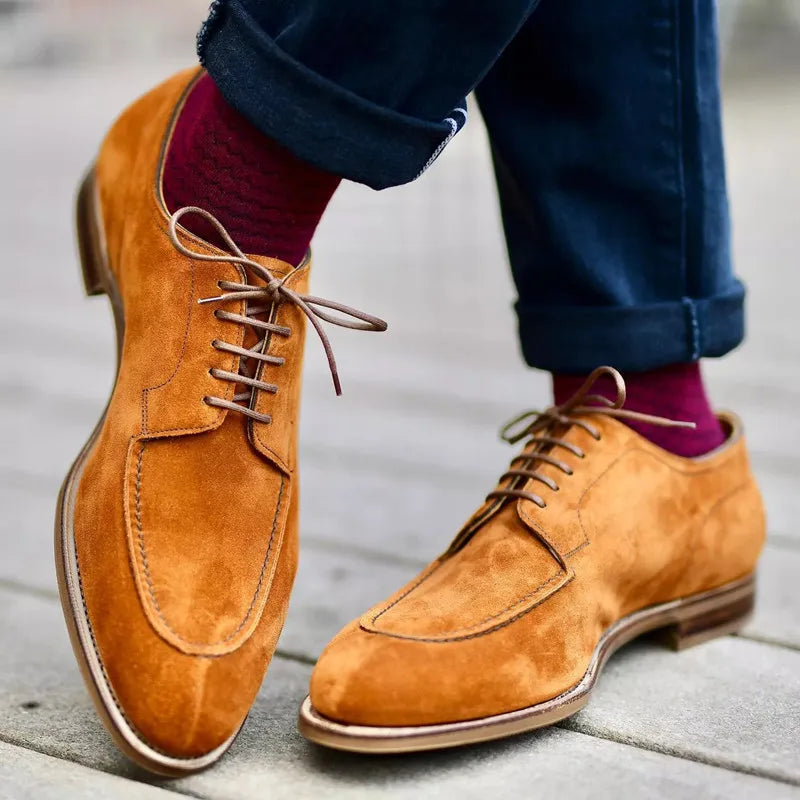 Men's classic brown leather Oxford dress shoes, perfect for refined formal or business casual style.