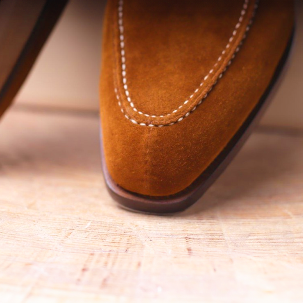 Dark brown leather men's Oxfords, durable formal footwear for sophisticated business and event attire.