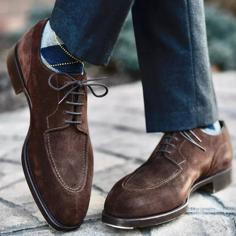 Classic men's black Oxford dress shoes, essential elegant formal footwear for timeless style and comfort.