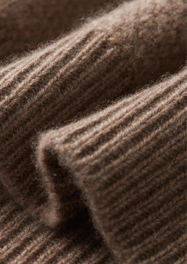 Stylish men's cable knit crew neck sweater, providing excellent warmth and a cozy feel for winter fashion.
