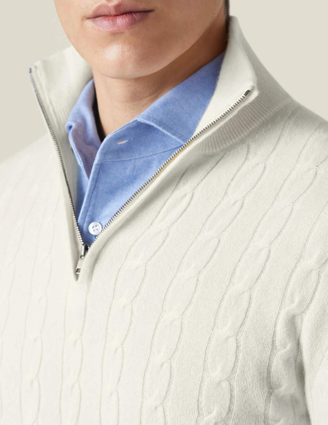 Full view of a men's classic cable-knit quarter-zip sweater in a timeless design.