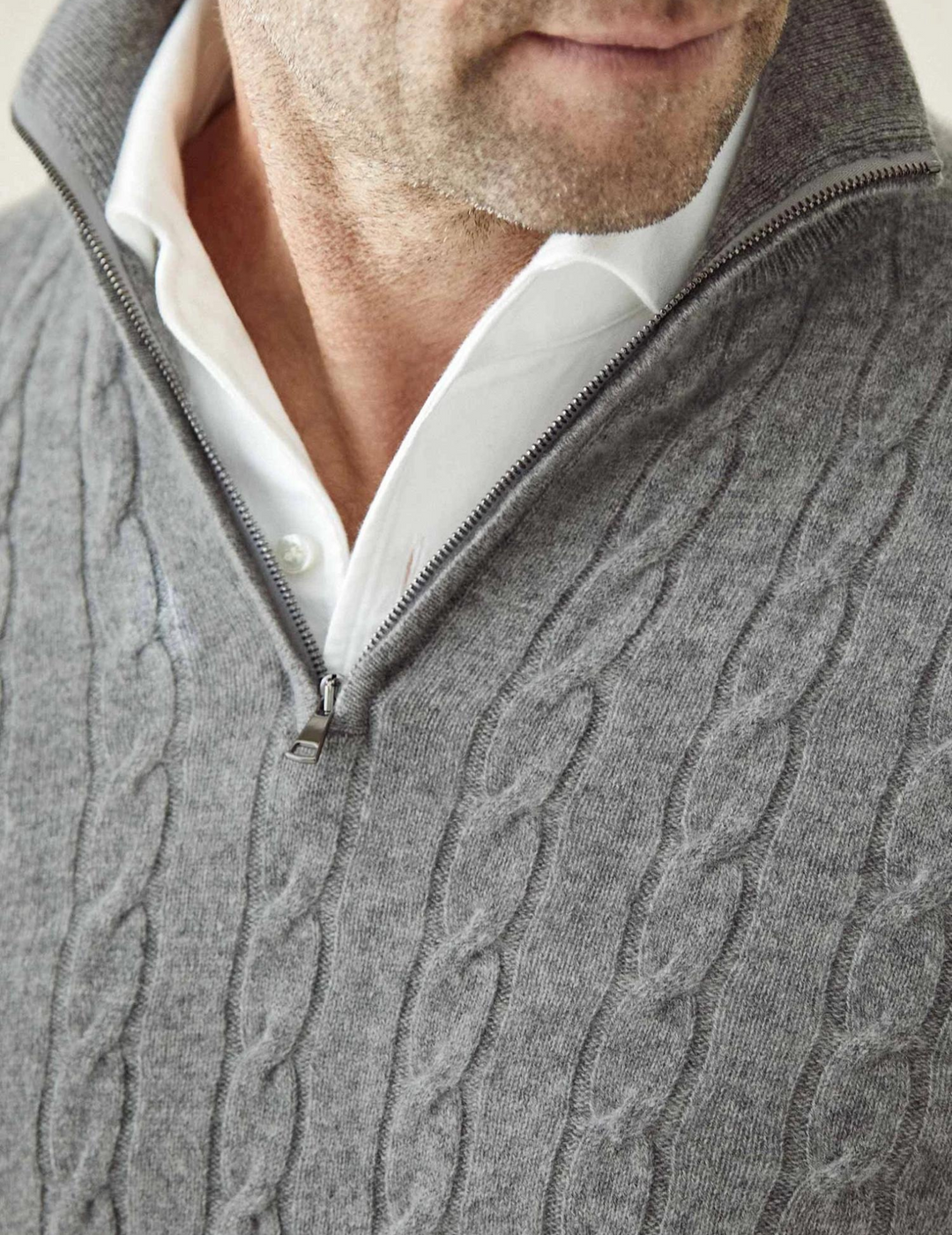 Men's warm and fashionable cable-knit quarter-zip sweater, suitable for diverse styling.