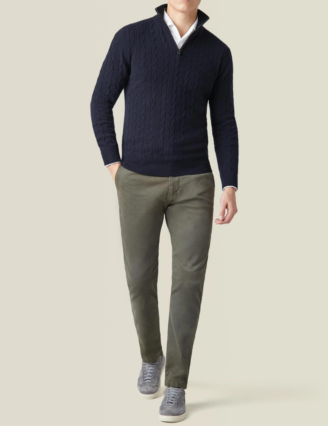 Versatile men's knit quarter-zip sweater in a classic cable design, offering cozy warmth.