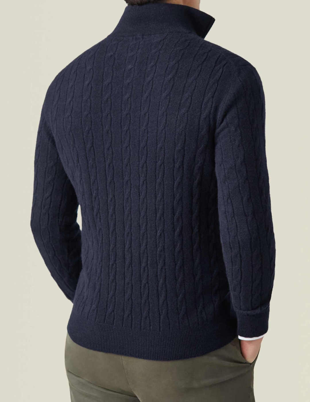 Elegant men's cable-knit quarter-zip pullover, a key piece for smart casual outfits.