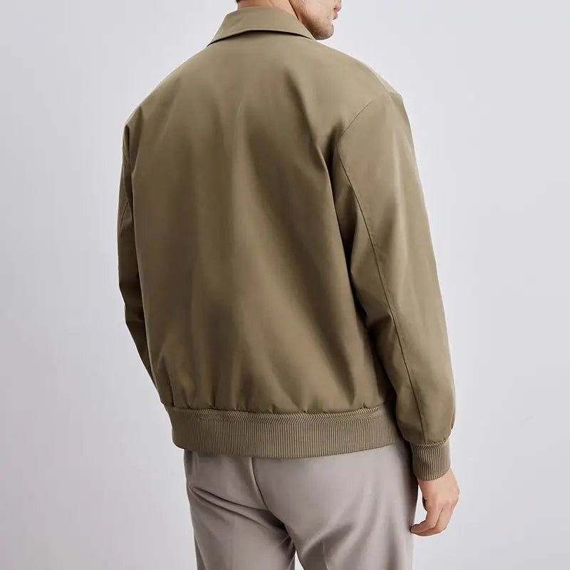 Navy men's classic Harrington jacket. Versatile casual outerwear, lightweight for layering fashion.