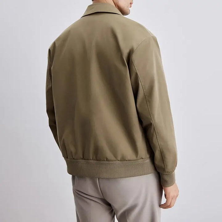 Navy men's classic Harrington jacket. Versatile casual outerwear, lightweight for layering fashion.