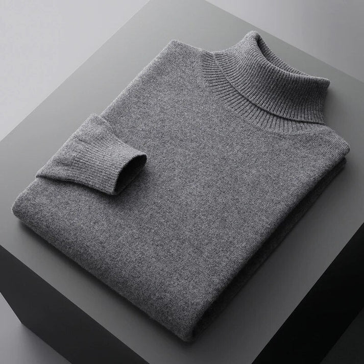Man wearing a stylish, slim-fit men's knit turtleneck sweater, perfect for a sophisticated business casual look.