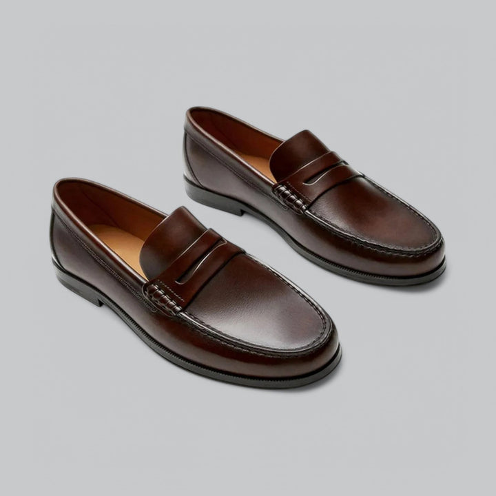 Premium leather men's penny loafers, essential classic dress shoes for both formal and business casual outfits.