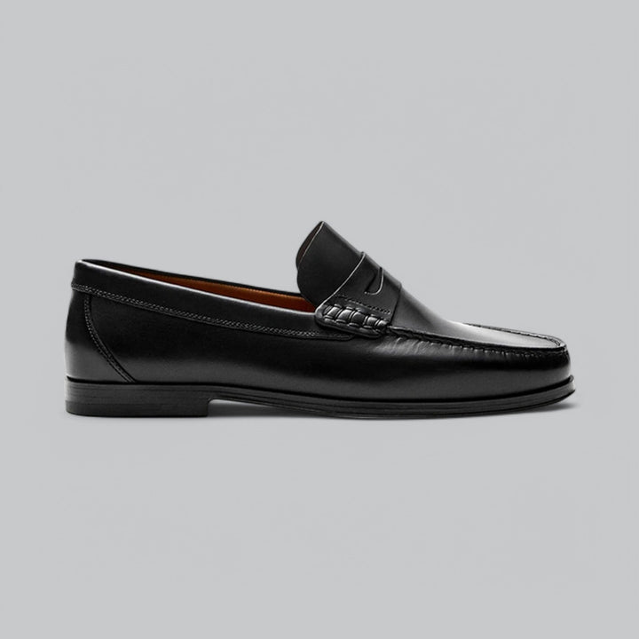 Men's polished leather penny loafers, sleek slip-on design with a durable sole, perfect for refined style.