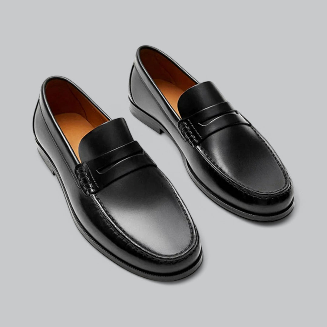 Brown leather men's penny loafers, a smart and comfortable choice for office wear and smart casual ensembles.