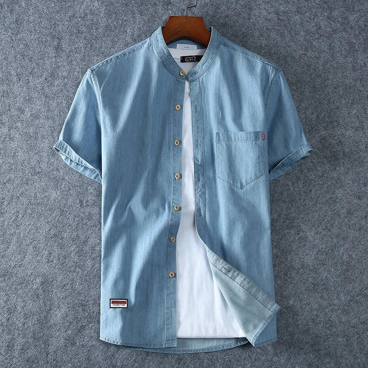 Versatile men's band collar polo shirt, ideal for casual summer outfits & coastal fashion. Comfortable short sleeve top.