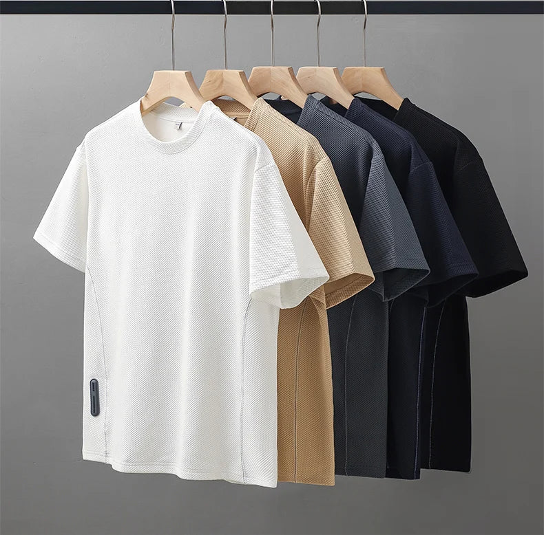 Stylish men's textured waffle knit shirt, short sleeve, crew neck, offering ultimate comfort for any occasion.