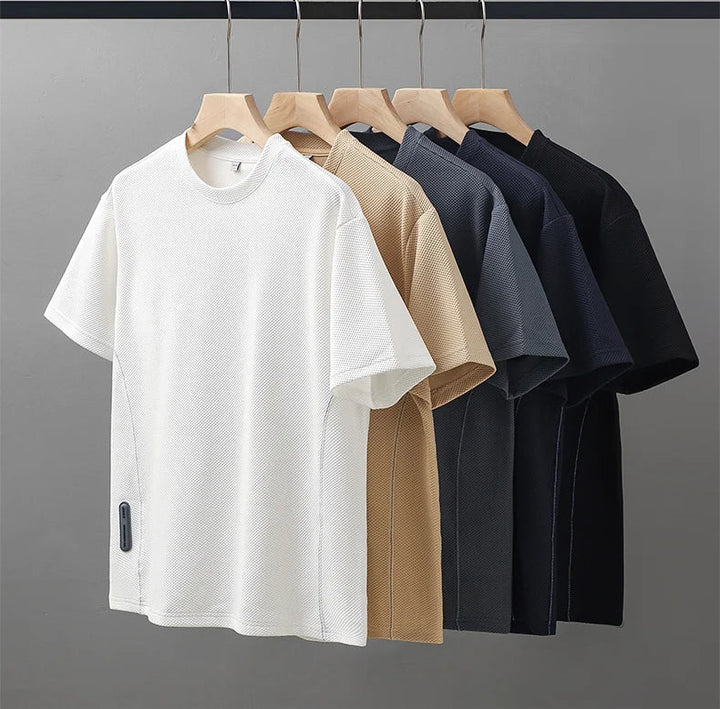 Stylish men's textured waffle knit shirt, short sleeve, crew neck, offering ultimate comfort for any occasion.