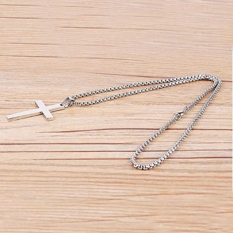Modern black cross pendant necklace for men, a stylish and spiritual men's fashion accessory.