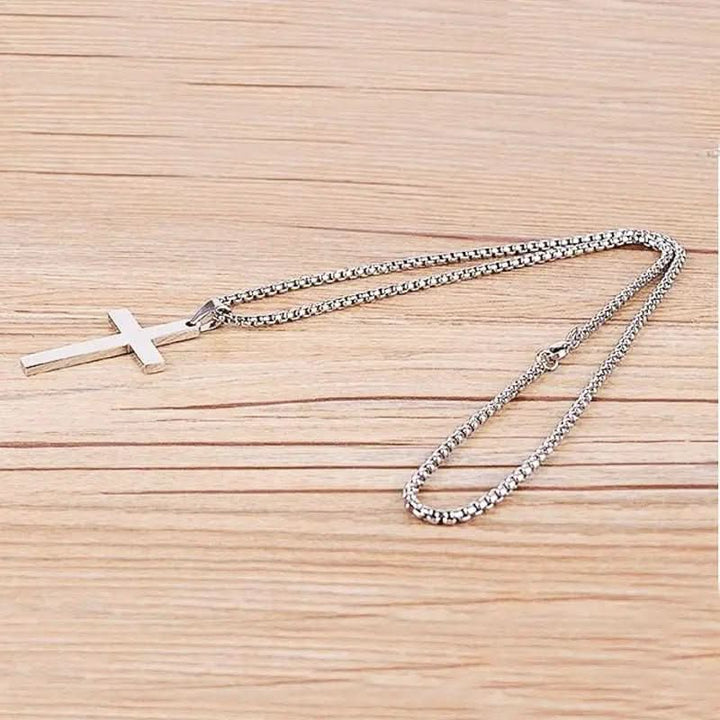 Modern black cross pendant necklace for men, a stylish and spiritual men's fashion accessory.