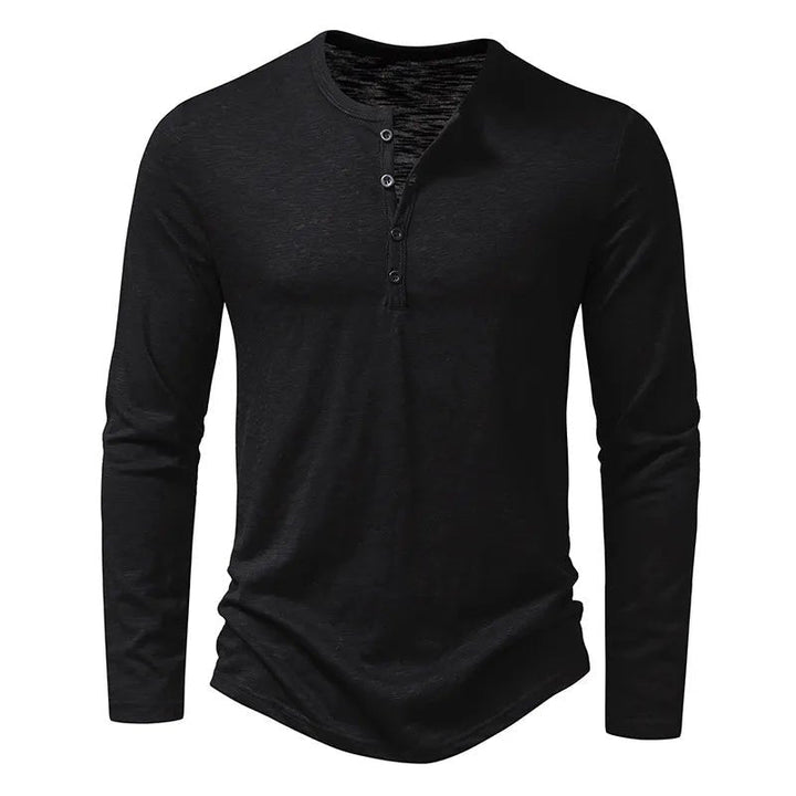 Close-up of the soft fabric on a men's classic slim fit long sleeve Henley shirt, placket visible.
