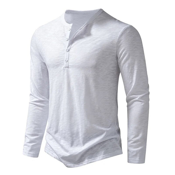 Neatly folded men's classic slim fit long sleeve Henley shirt, ready for comfortable versatile everyday wear.