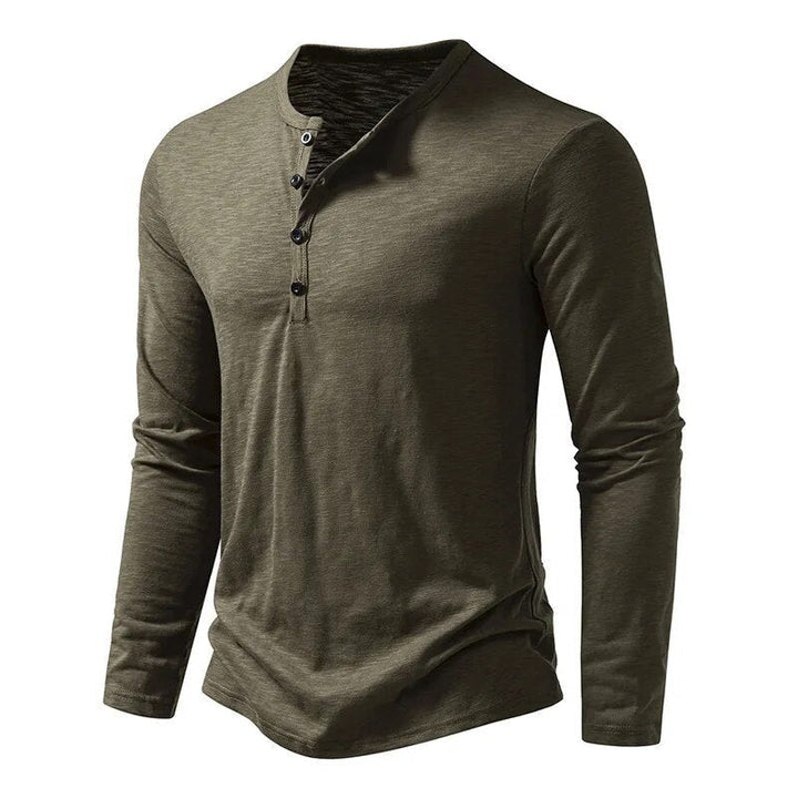 Stylish men's slim fit Henley shirt with classic button placket & long sleeves, a wardrobe essential.