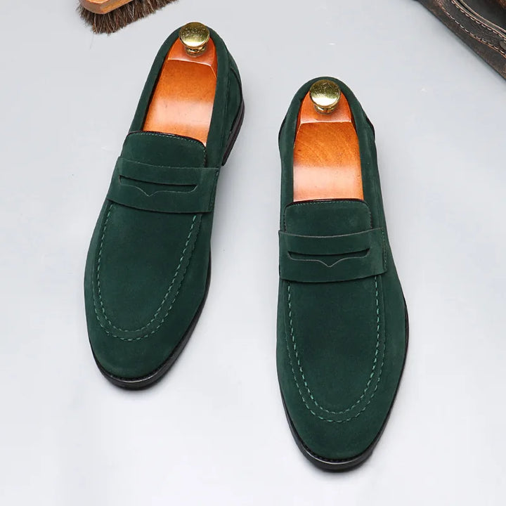 Close-up of black men's slip-on loafers, highlighting quality craftsmanship & classic design.