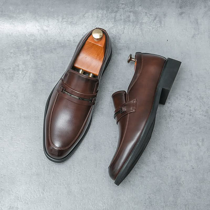 Stylish brown men's slip-on loafers, ideal for refined casual or dress shoe fashion. Comfortable & durable footwear.