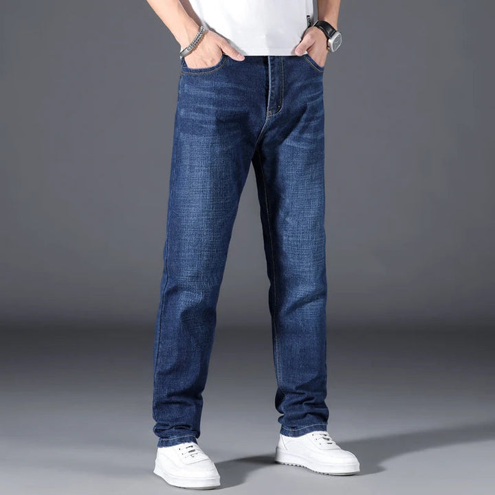 Durable men's black straight leg denim jeans, offering a comfortable, relaxed fit for versatile everyday wear.
