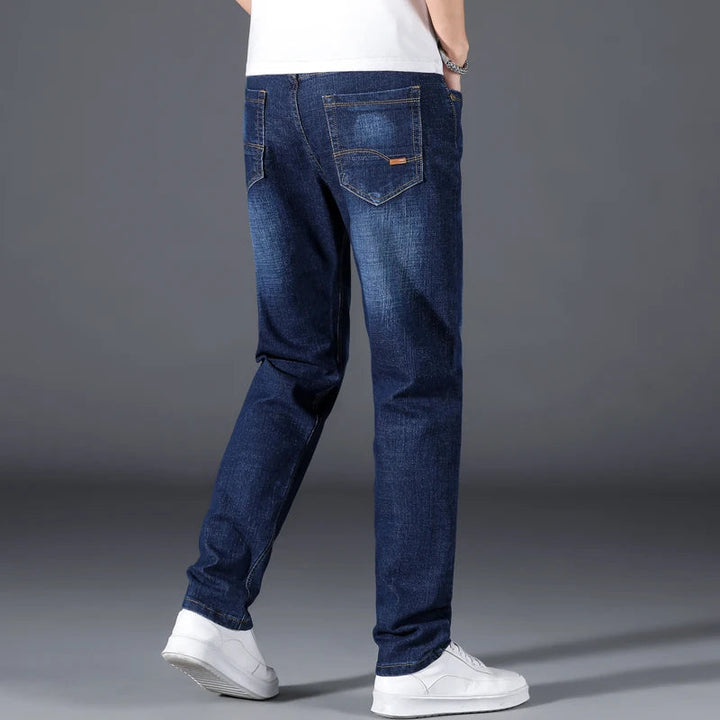 Classic fit men's straight leg blue denim jeans, ideal for comfortable, versatile everyday style.