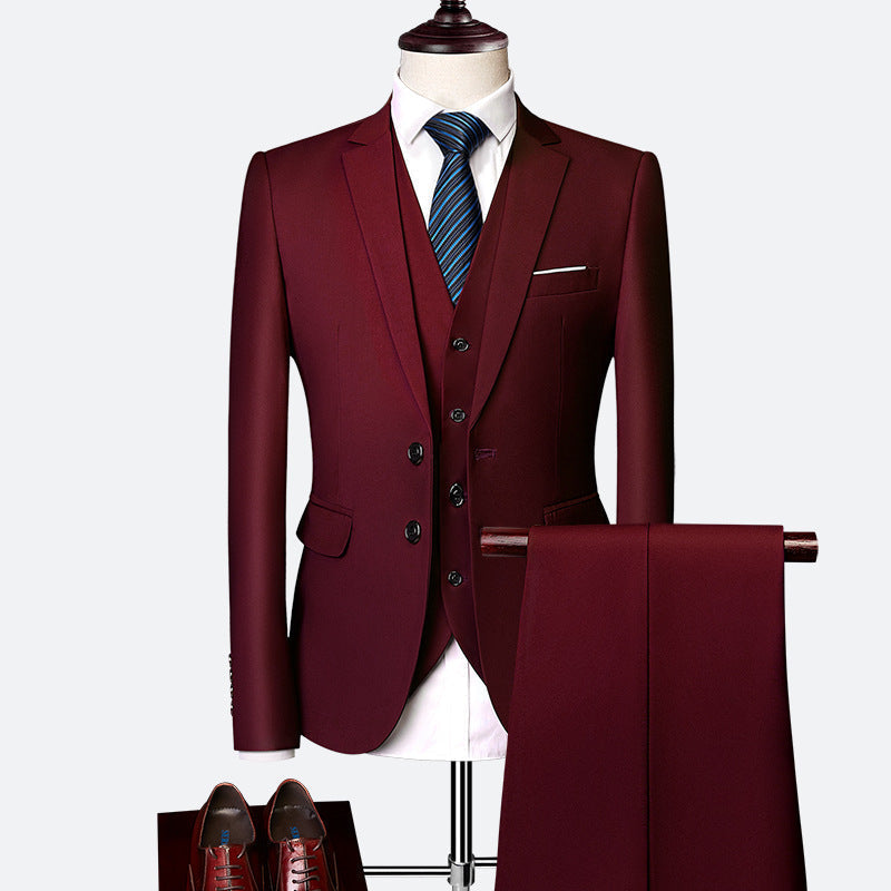 Modern slim fit men's three-piece suit with a crisp white shirt, perfect for professional business wear.