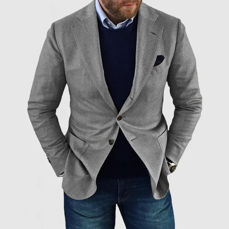 Tailored men's two-button blazer, a sophisticated choice for formal wear, office, or event attire. Classic style.