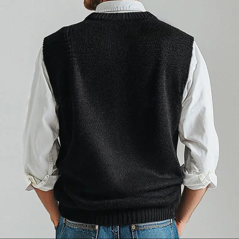 Black men's V-neck knit vest, perfect for layering over shirts, offering classic style & comfort.