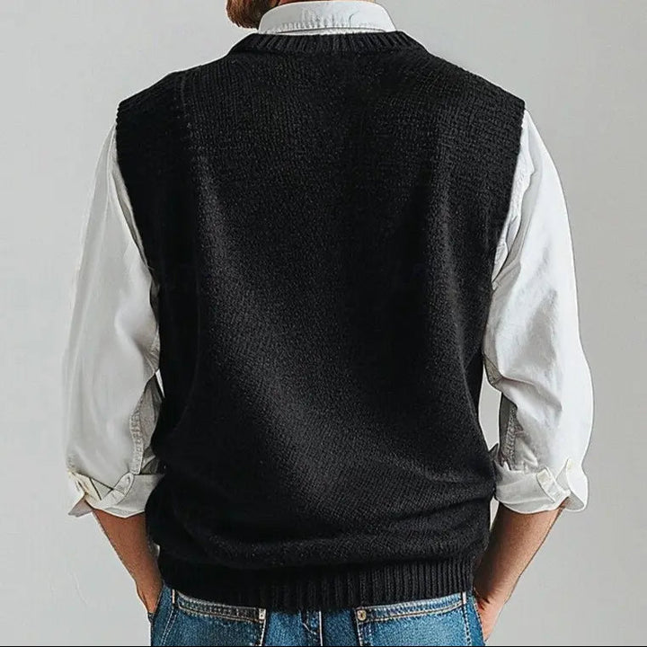 Black men's V-neck knit vest, perfect for layering over shirts, offering classic style & comfort.