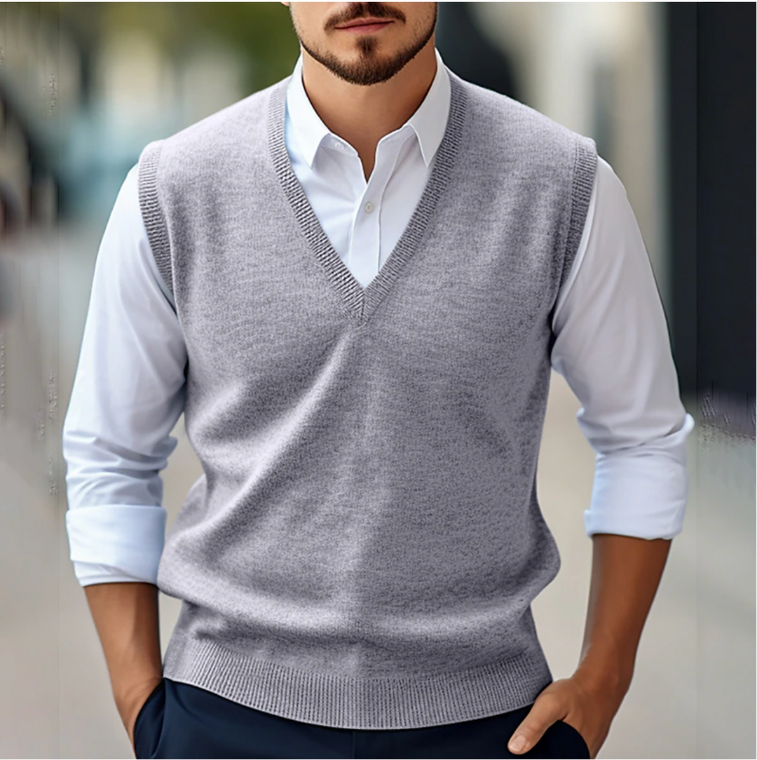 Sophisticated men's V-neck sweater vest, ideal for business attire & professional layering. Comfortable knitted fabric.