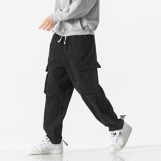 Detail shot of comfortable men's drawstring cargo pants, showcasing pockets and fabric.