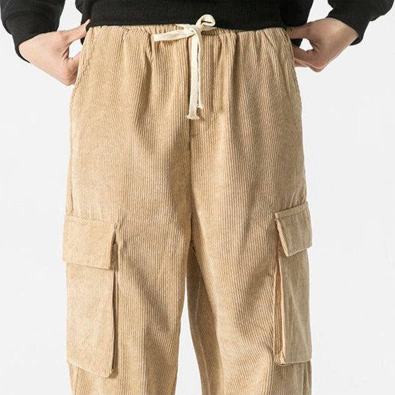 Side view of men's comfortable cargo pants with drawstring, showcasing a relaxed fit.