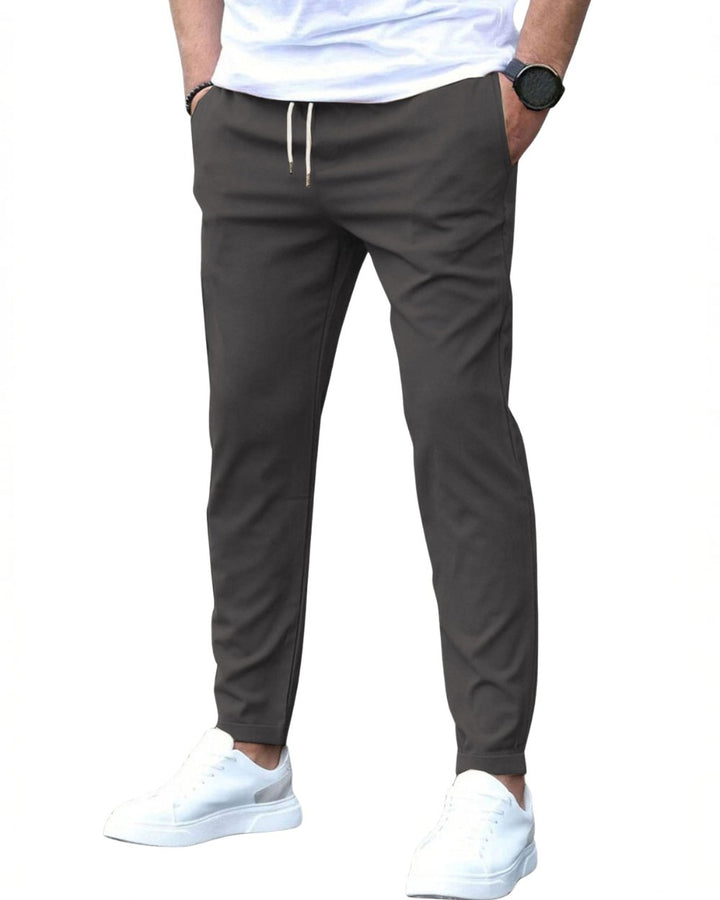 Modern slim fit men's drawstring chino pants, perfect for versatile comfort.