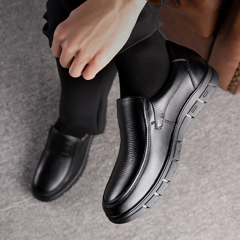 Side view of modern men's slip-on loafers, offering comfort and refined casual fashion.