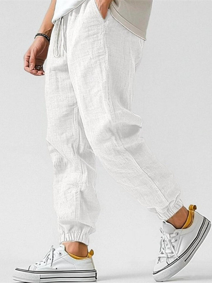 Stylish men's tapered joggers with elastic drawstring waist & cuffed ankles for a comfortable, casual fit.