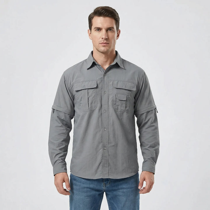 Practical men's trekking shirt with zip-off sleeves for adaptability and quick-dry comfort on the trail.