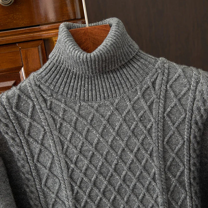 Textured cable knit men's turtleneck sweater, offering cozy warmth and timeless style for fall & winter.
