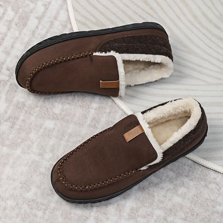 A pair of men's warm slip-on house shoes, designed for cozy indoor comfort in winter.