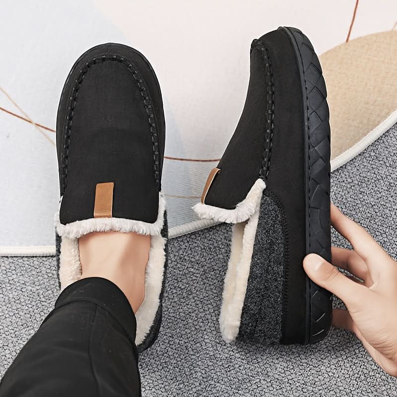 Soft men's indoor footwear, designed as slip-on house shoes for cozy winter warmth.