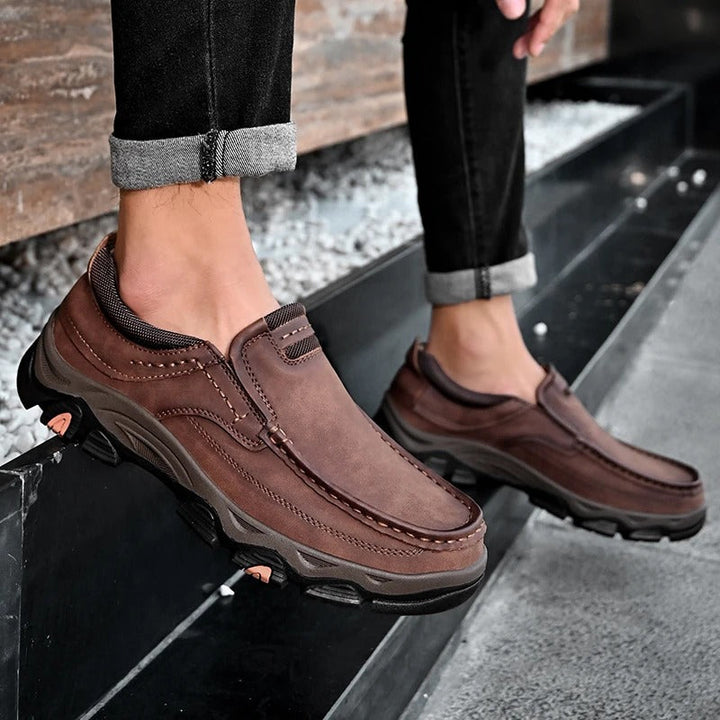 Men's Dakota slip-on loafers in dark brown, providing durable comfort & excellent traction.