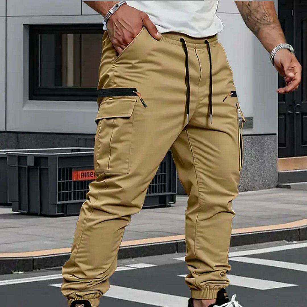 Tapered fit men's cargo jogger pants with utility pockets, featuring dynamic stretch for casual & active lifestyles.