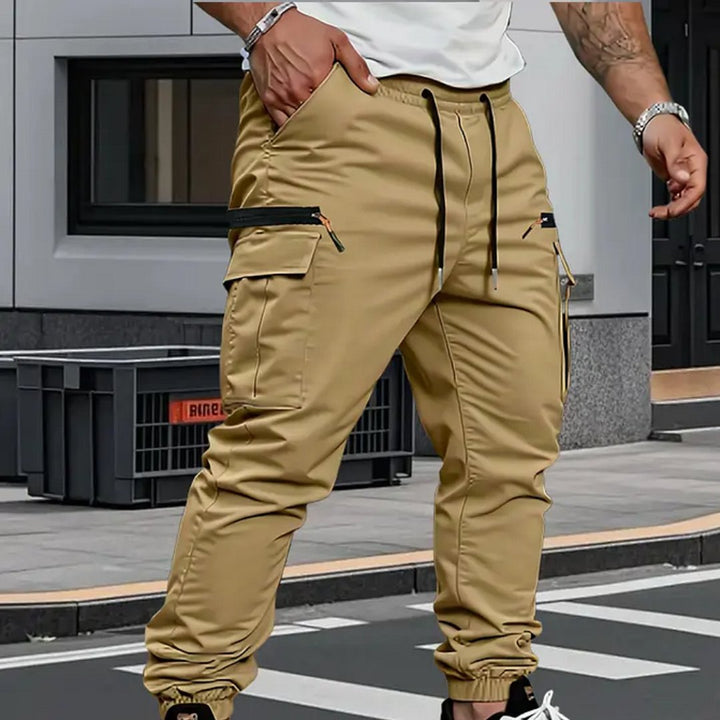 Tapered fit men's cargo jogger pants with utility pockets, featuring dynamic stretch for casual & active lifestyles.