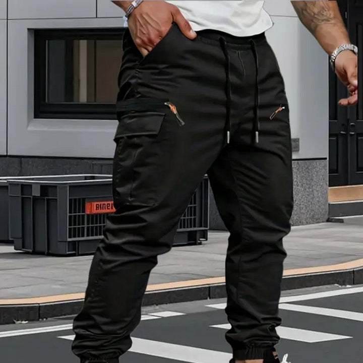 Men's stylish tapered jogger cargo pants, offering dynamic stretch, comfort, & practical utility pockets.
