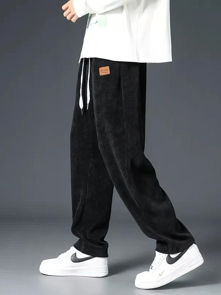 Men's Echelon black relaxed straight-leg pants with elastic waist for ultimate comfort & versatile everyday wear.