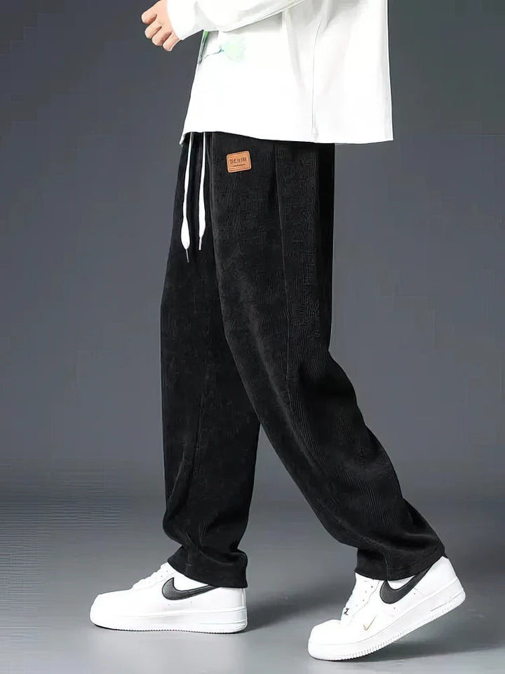 Men's Echelon black relaxed straight-leg pants with elastic waist for ultimate comfort & versatile everyday wear.