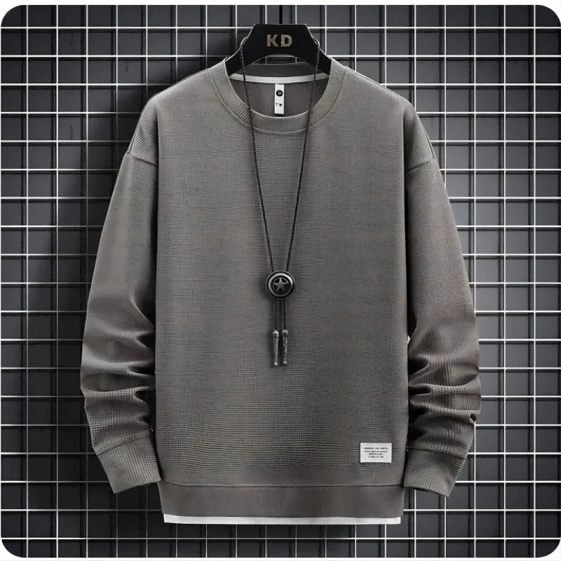 Two-piece men's knit lounge set with relaxed fit joggers & cozy sweater for casual comfort.