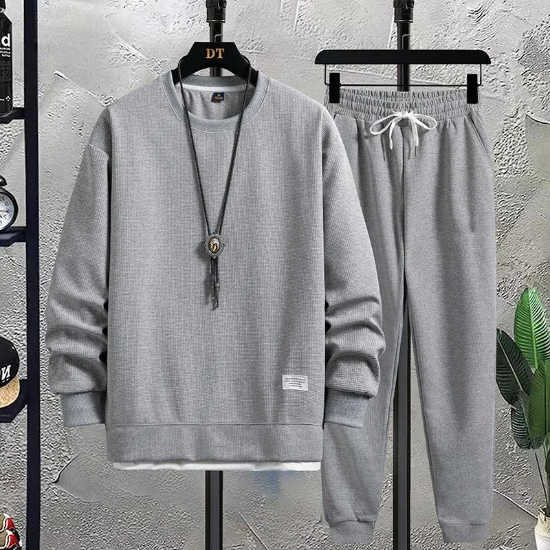 Effortless men's knit sweater & jogger set, ideal for relaxing at home or casual errands.