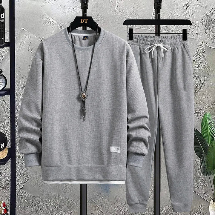 Effortless men's knit sweater & jogger set, ideal for relaxing at home or casual errands.