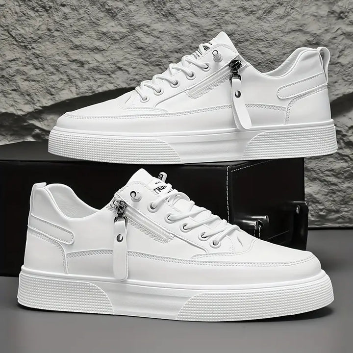 Pair of men's comfortable sneakers, essential for casual wear, featuring a useful side zip and laces.